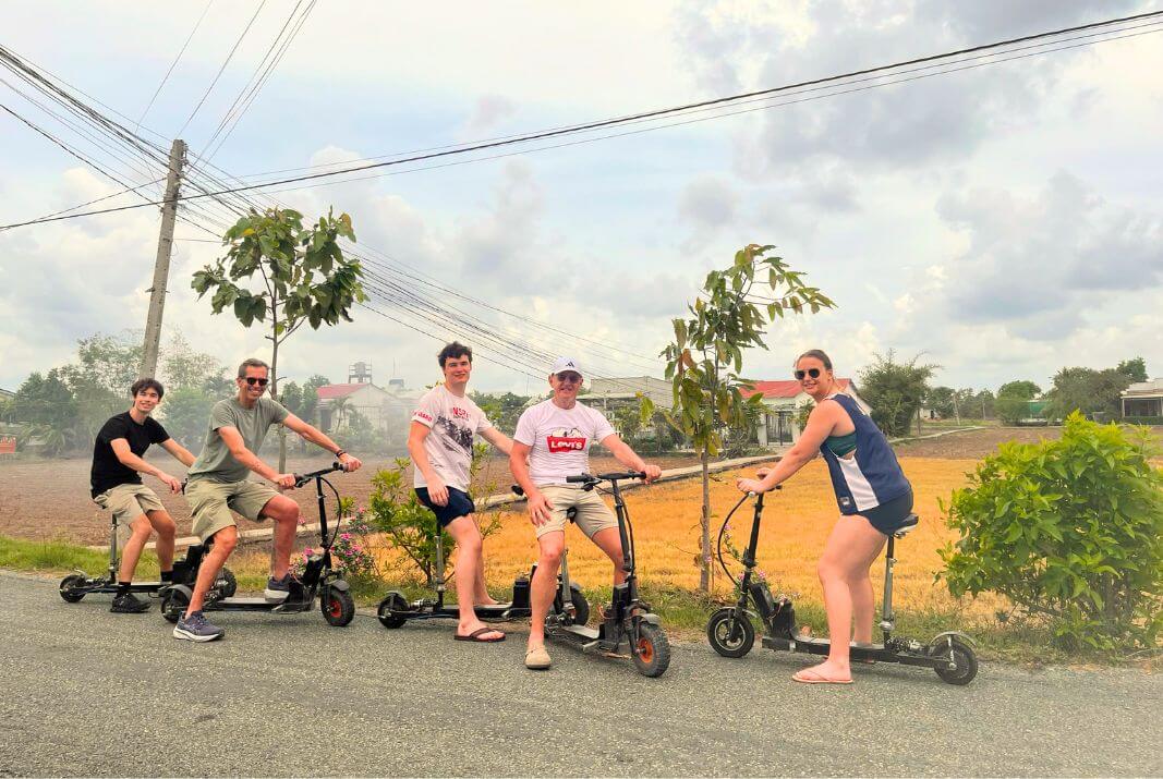 Travellers riding e-scooter