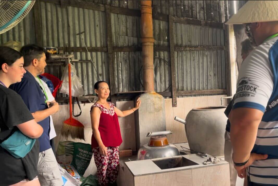 Local Craft of Rice Wine Making Passed Down Through Generations Local woman with three generations of rice wine making tradition